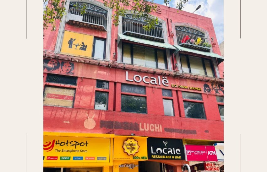 Real image of commercial building for sale in Saket near PVR Complex, featuring retail outlets and restaurants in a high-footfall commercial zone.